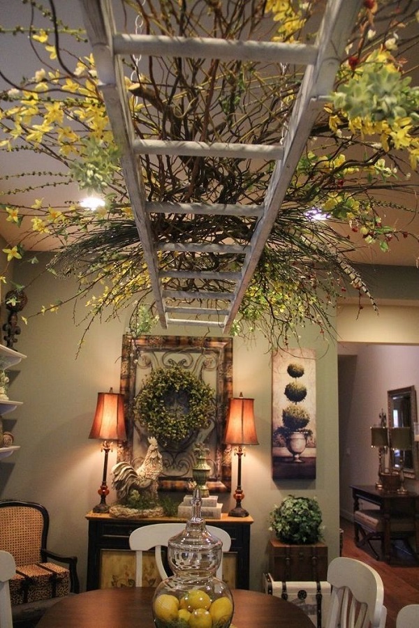 Ceiling centerpiece made of ladder and branches