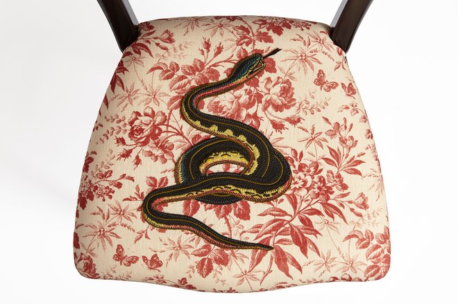 Printed Gucci chair with a snake applique