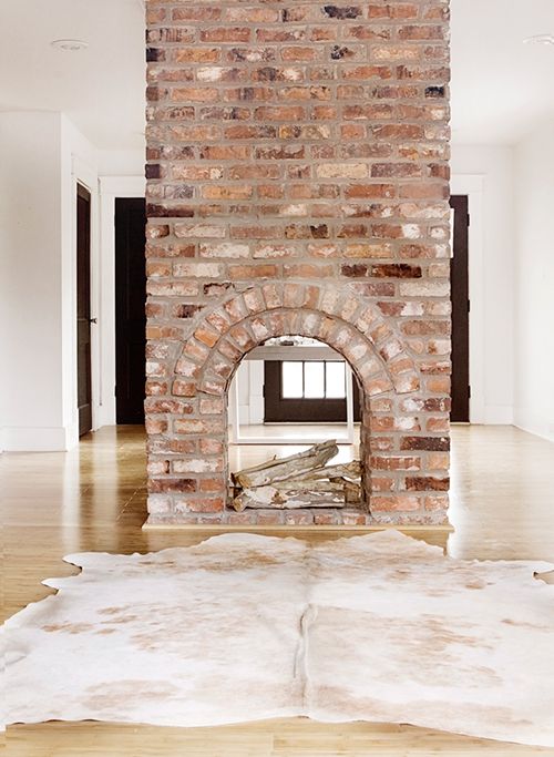 Exposed brick fireplace