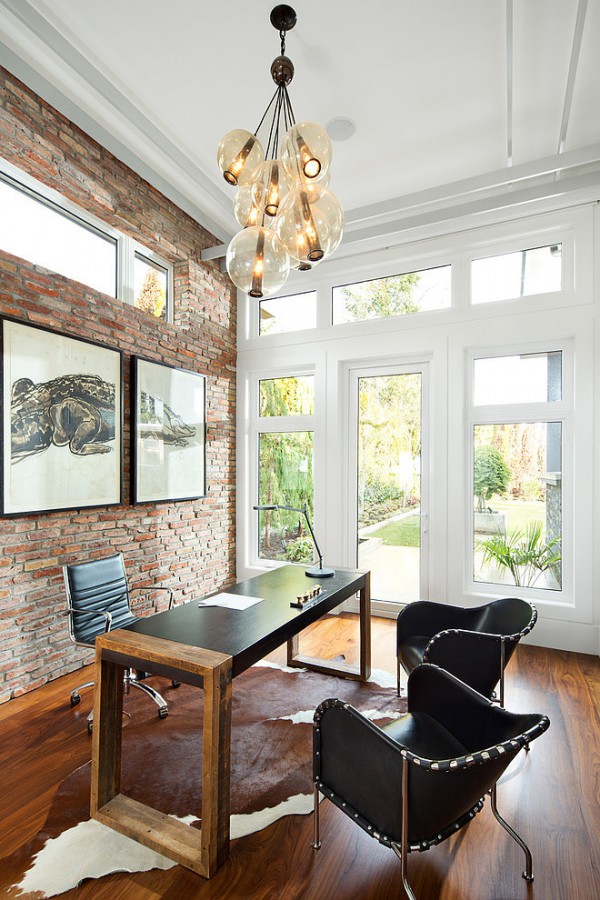 Home office with exposed brick wall